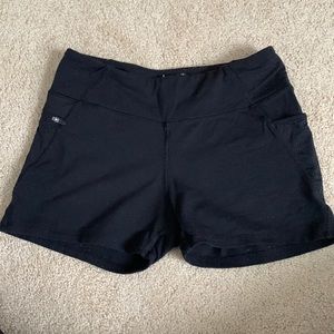 Black fitted workout shorts with pockets on sides